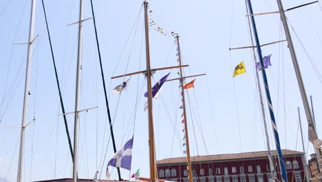 colorful flags waving on a ship's mast