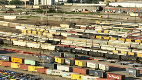 aerial view of a bustling train yard and intermodal container terminal