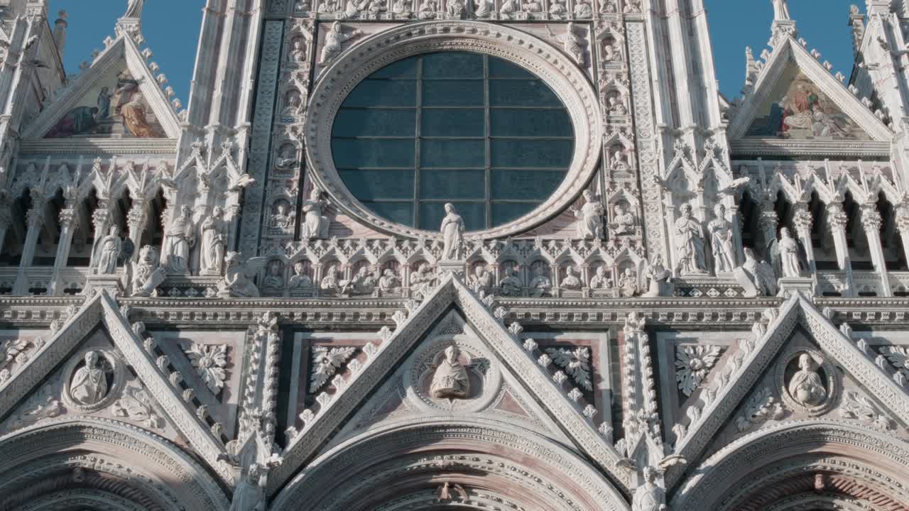 The front facade of the Duomo di Siena in Italy.