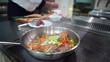 chef preparing vegetables for a dish