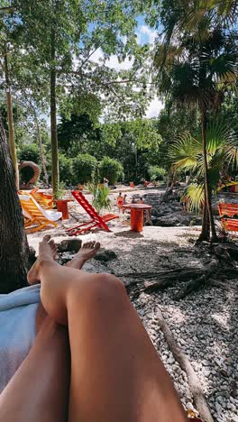 relaxing by the pool in a tropical garden