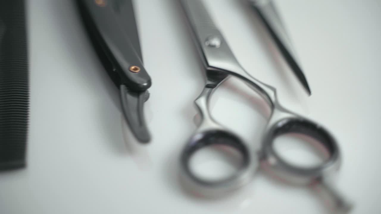 Rotating Shot Of Professional Hairdressing Scissors And Tools