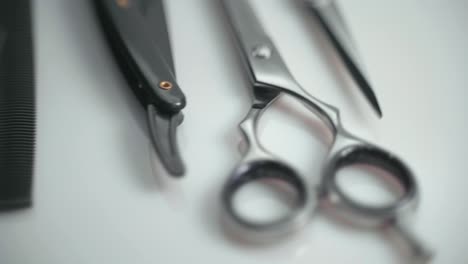 Rotating-Shot-Of-Professional-Hairdressing-Scissors-And-Tools