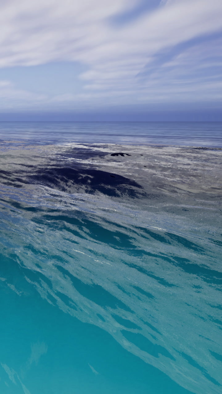 Vibrant surf dances over shimmering waters under a peaceful sky