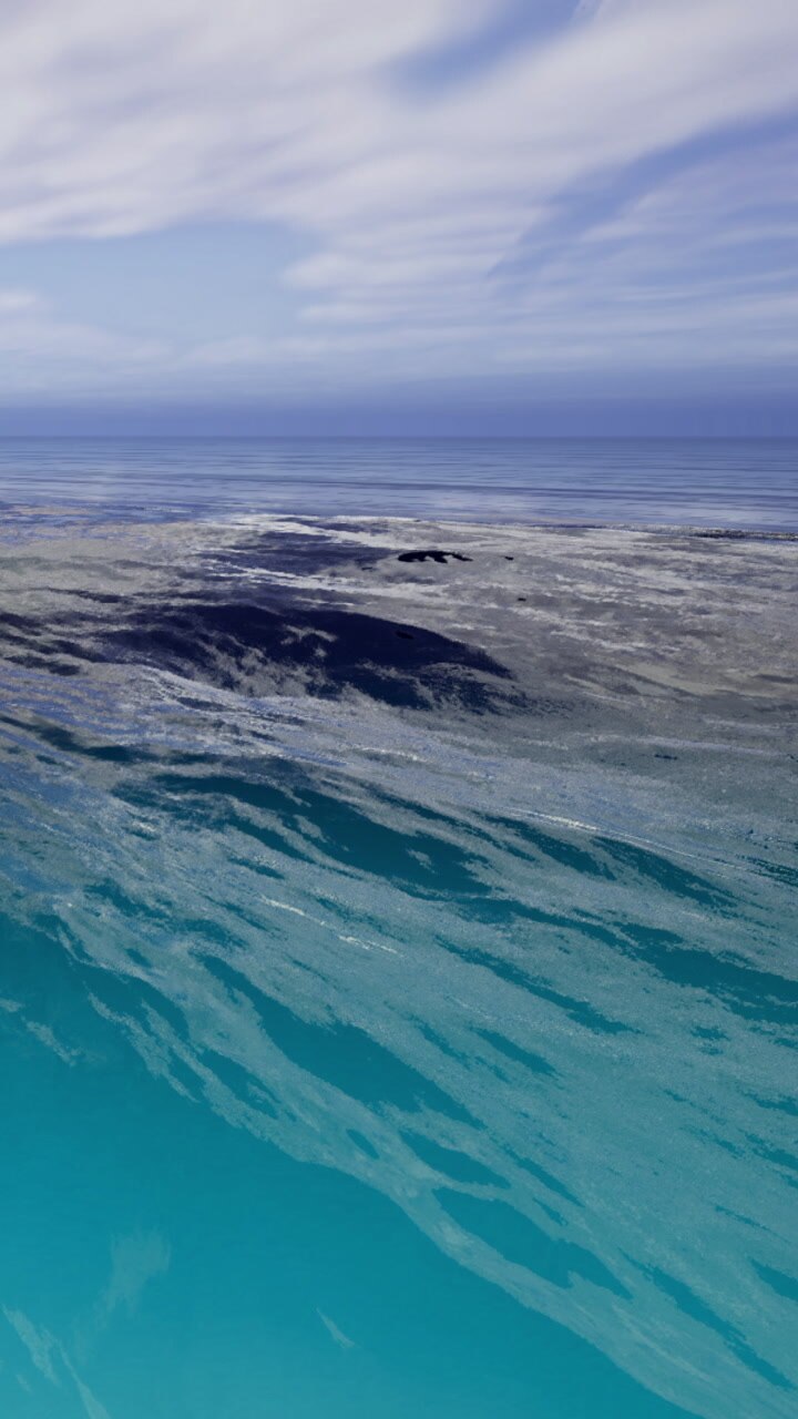 Vibrant surf dances over shimmering waters under a peaceful sky