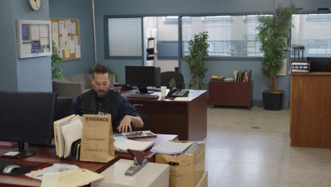 Black-african-american-police-officer-in-a-precinct-on-desk-duty