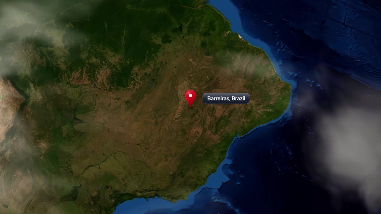 Satellite animation zooms from outer space into South America, pinning Barreiras, Brazil on the map. Includes NASA public domain imagery.