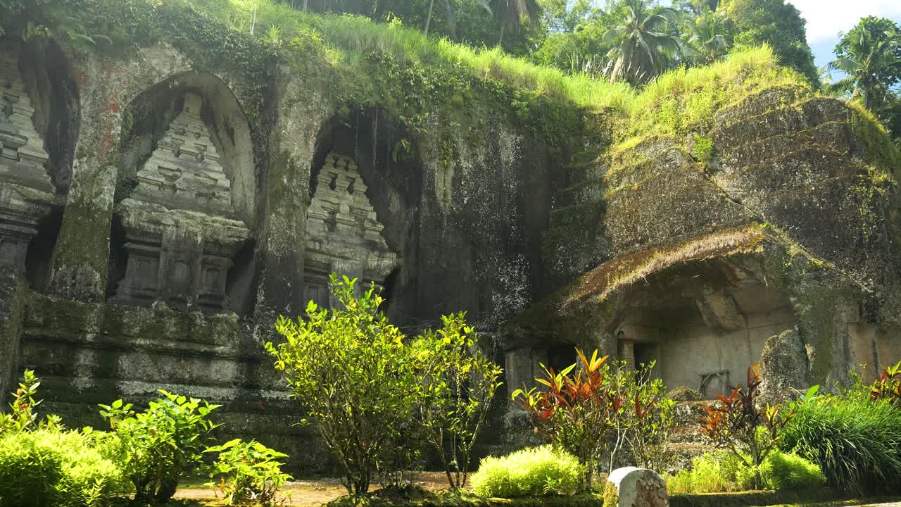 Slow motion camera ride from a beautiful temple in the heart of the jungle in Bali indonesia during an adventurous trip