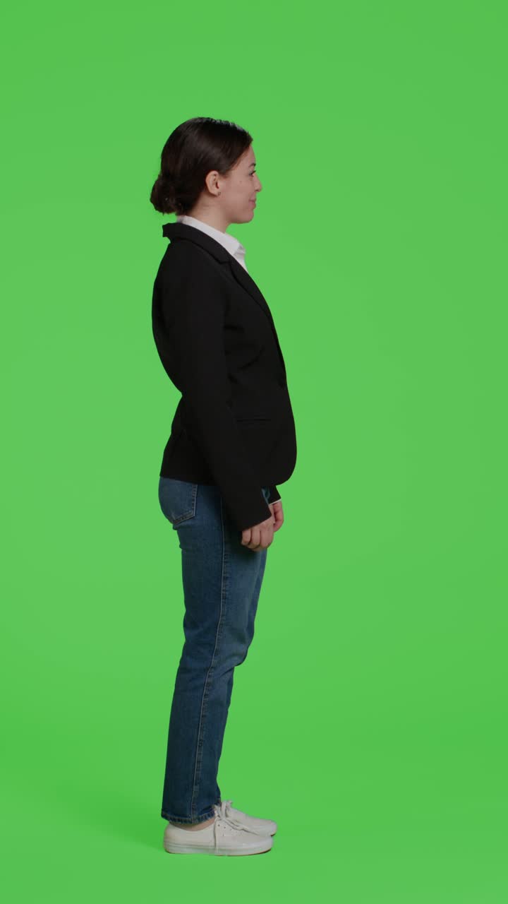 Vertical video: Profile of young businesswoman acting confident wearing suit