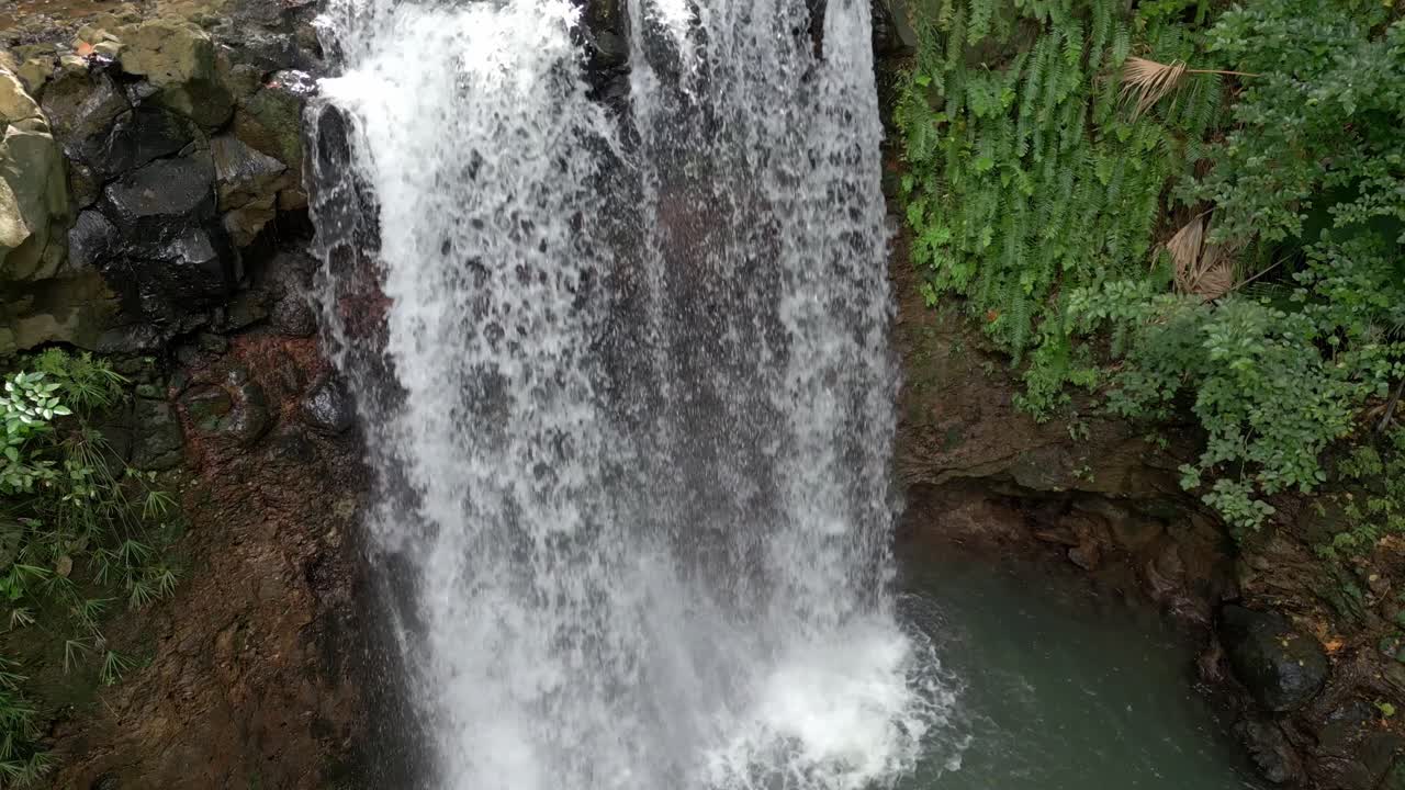 Mauritius - Souillac - Fast tilt down,fixed and tilt up view on the Mamzel Waterfall
