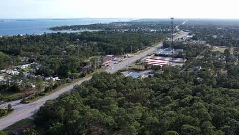 Small-coastal-town-with-cell-tower-in-foreground