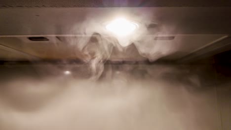 slow motion of smoke on a kitchen hood