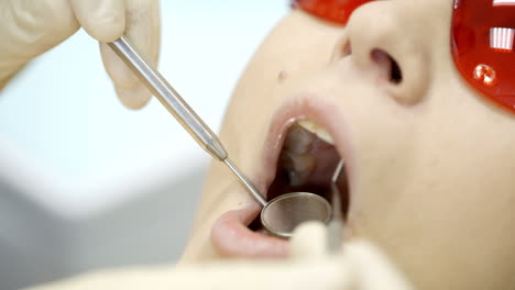 woman being under dentists examination