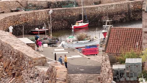 tourists exploring a scenic port in fife