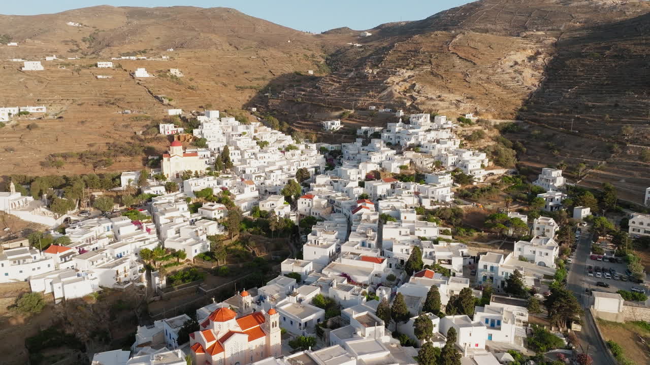 Saint Dimitrios, Halepas Museum in historical Pyrgos village on Tinos Island, White washed houses surrounded by terraced farm lands, mountains, Cyclades, Aerial closeup