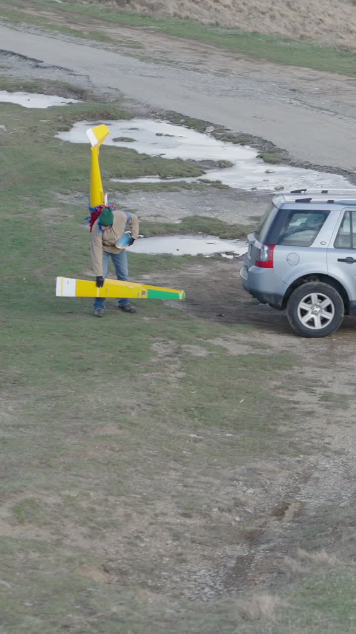 Man and Land Rover in a field