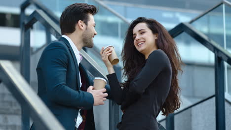 Young-business-man-and-woman-talking-on-the-street.