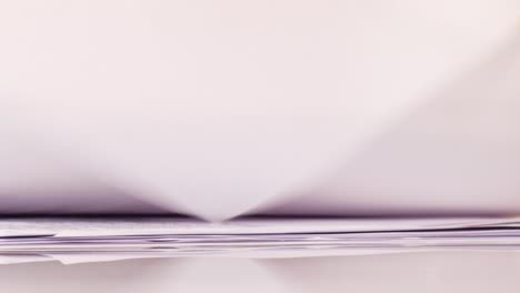 anchorwoman's hands close-up as she riffles through her notes at the news desk