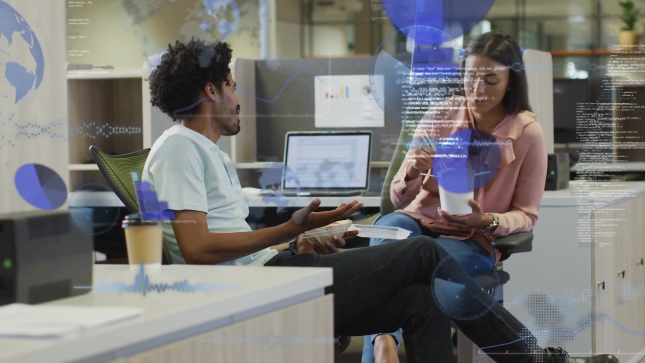 Vertical video: Team discussing business while eating, laptop chart updating, blue AR UI appearing