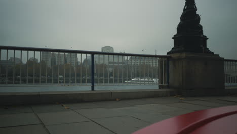 slider shot overlooking river thames on a foggy overcast day in london uk