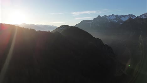 Aerial-Orbit-above-Beautiful-Mountain-Landscape-surrounded-by-forest