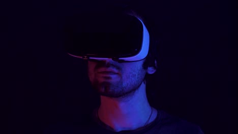 person wearing vr headset in the dark