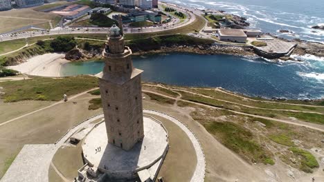 Aerial-towards-Historic-Hercules-tower-la-Coruña-Coastline-Background,-North-of-Spain