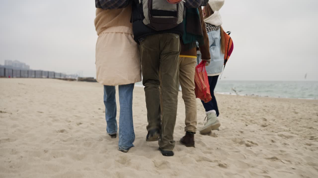 Group of Friends Walking on a Beach