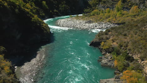 Flying-through-valley-following-famous-Kawarau-River,-Queenstown,-New-Zealand