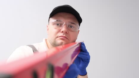 Man using a level tool