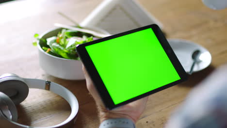 person using tablet at a restaurant