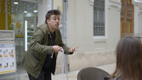 magician performing rope trick on a city street