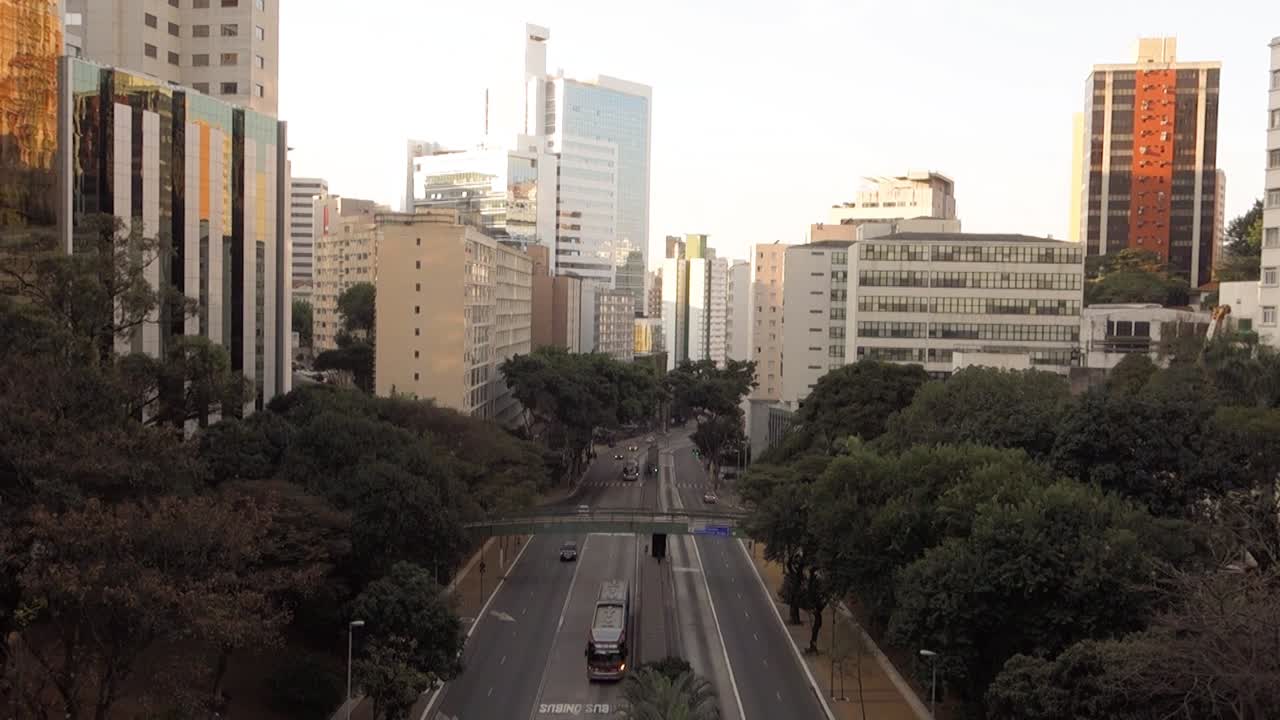 buildings cityscape and light traffic on '9 de Julho avenue' in Sao Paulo, Brazil, at dusk. High angle