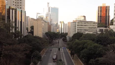 buildings cityscape and light traffic on '9 de julho avenue' in sao paulo, brazil, at dusk. high angle