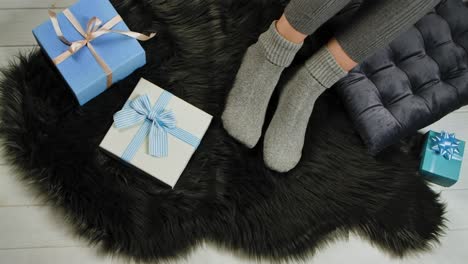 cozy feet with christmas presents