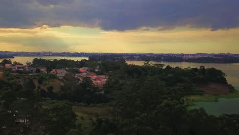 beautiful aerial view flying backwards over the sao paulo favelas at sunset