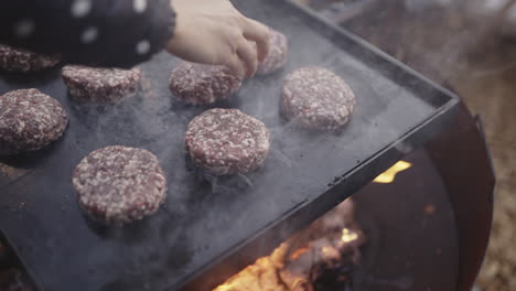 cooking burgers outdoors