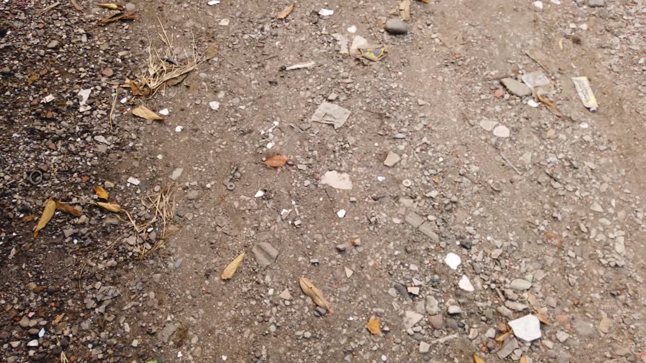 Point of view walking on rocky red soil