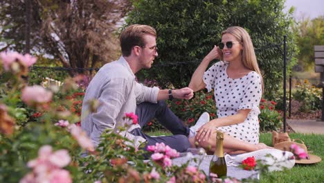 man and woman have a deep and meaningful chat in rose gardens