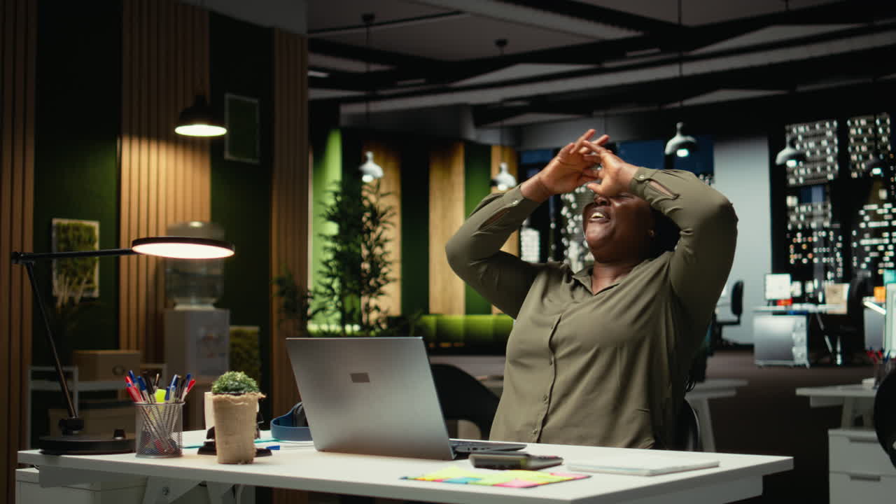 Overjoyed delighted person reading good news in her emails at night