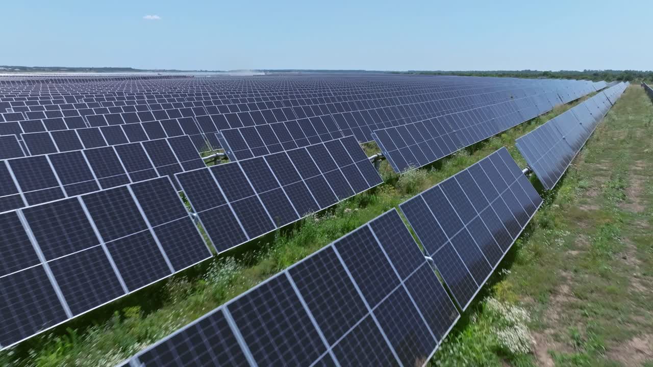 Expansive solar panels in sunny field, clean energy concept