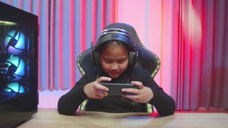young gamer playing mobile game