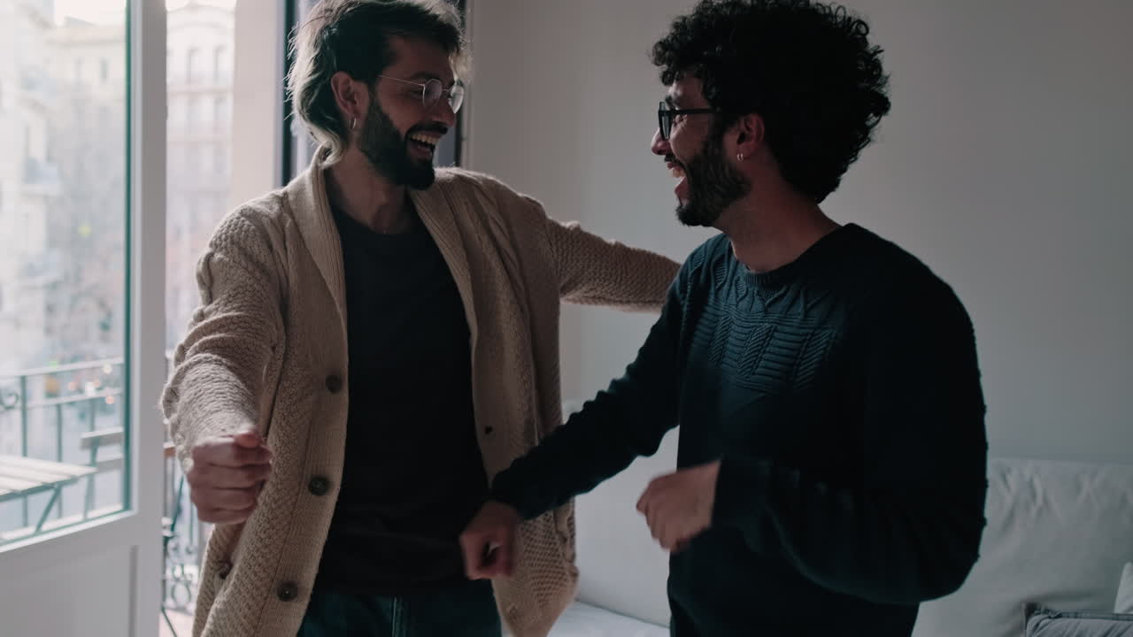 Gay Couple Dancing at Home Together