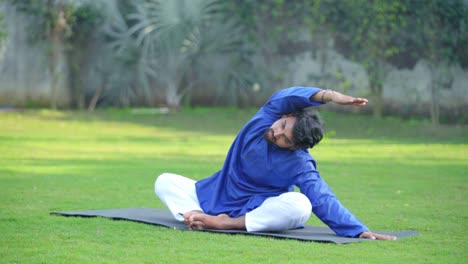 Young-Indian-man-doing-yoga-and-stretching