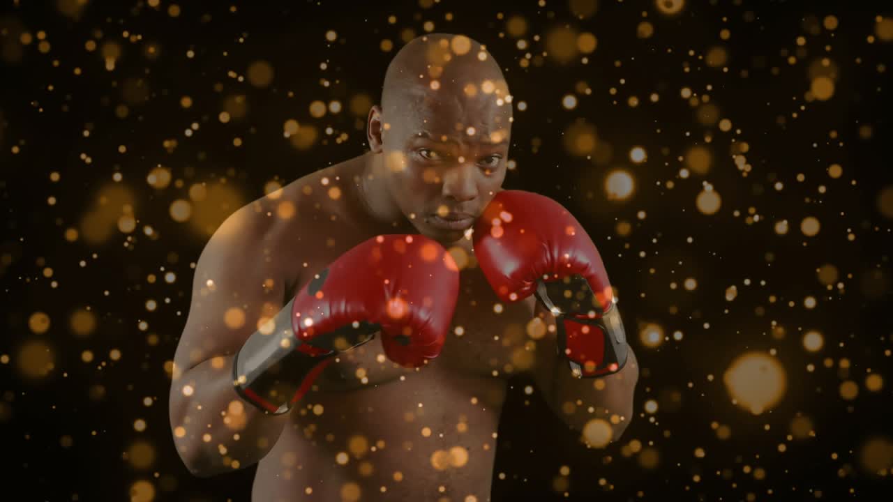 Male boxer holding guard bobbing to avoid imagined hit while red gloves glinting in golden overlay