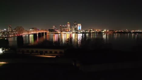louisville, kentucky skyline at night with drone video moving up