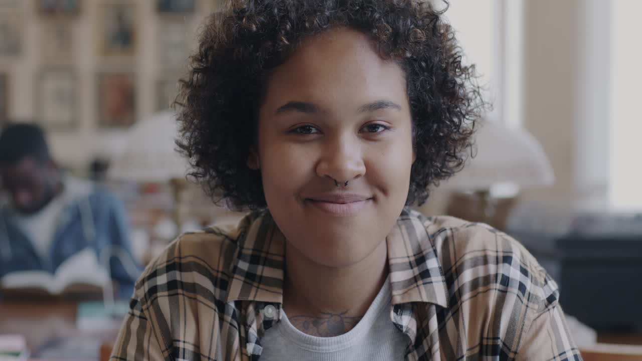 Young woman smiling in a library
