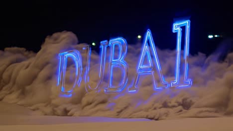 glowing neon dubai sign rising from dense clouds of dust at night, creating a captivating scene filled with mystery and intrigue, illuminating the urban landscape with vibrant colors