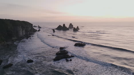 sunrise over rocky coastline
