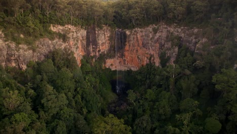 Purling-Brook-Falls-seen-from-above-filmed-with-a-Drone,-Australia